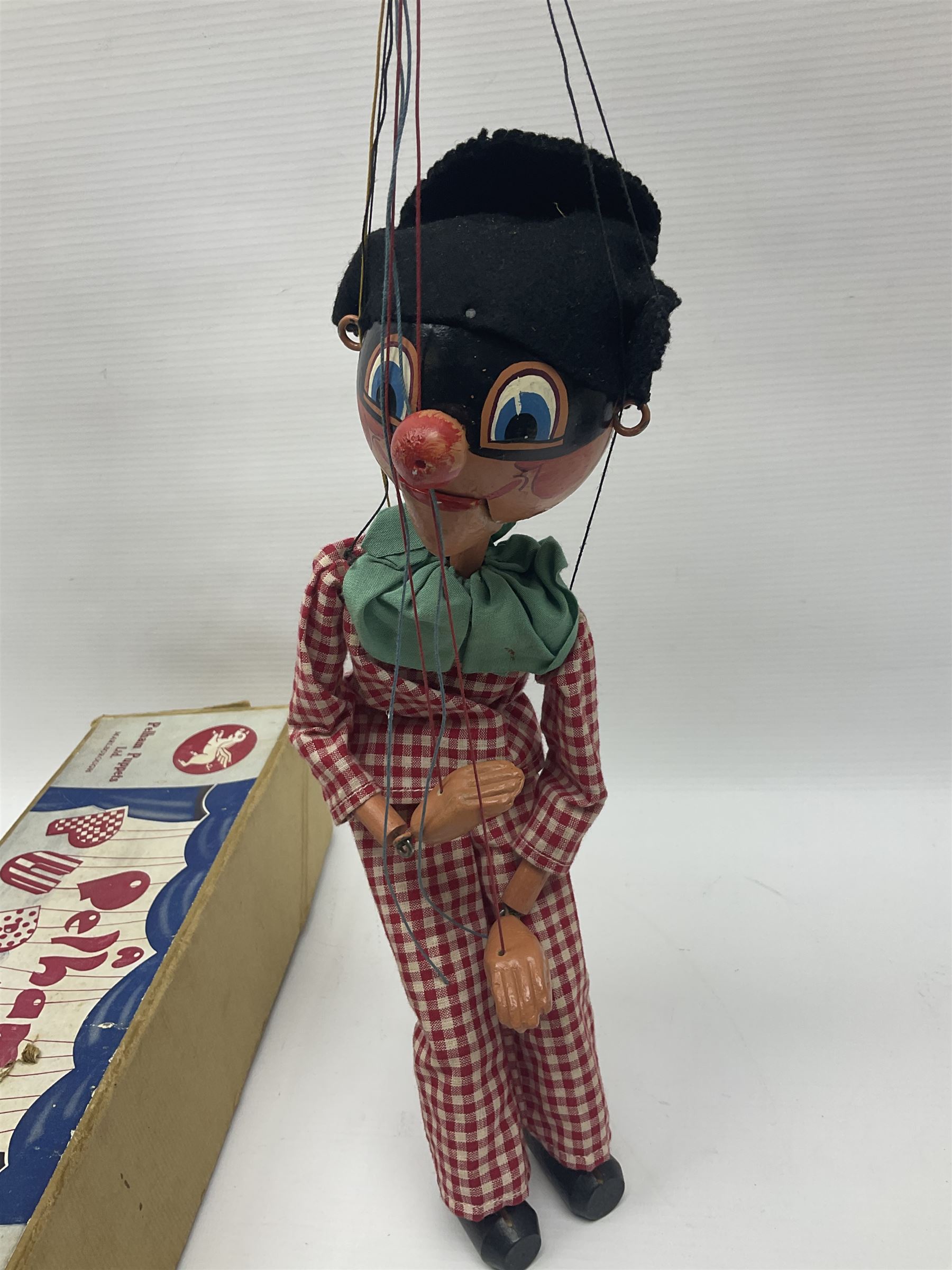 Pelham Puppet - a rare type SM Harlequin circa 1950s with painted black face mask, black felt hat, green ruff and red white chequered suit, H31cm; in original box with instructions 