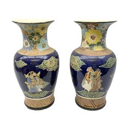 Pair of oriental floor vases of baluster form, decorated with figures and clouds upon blue ground, with key fret bordering and floral panel to the neck, H52cm