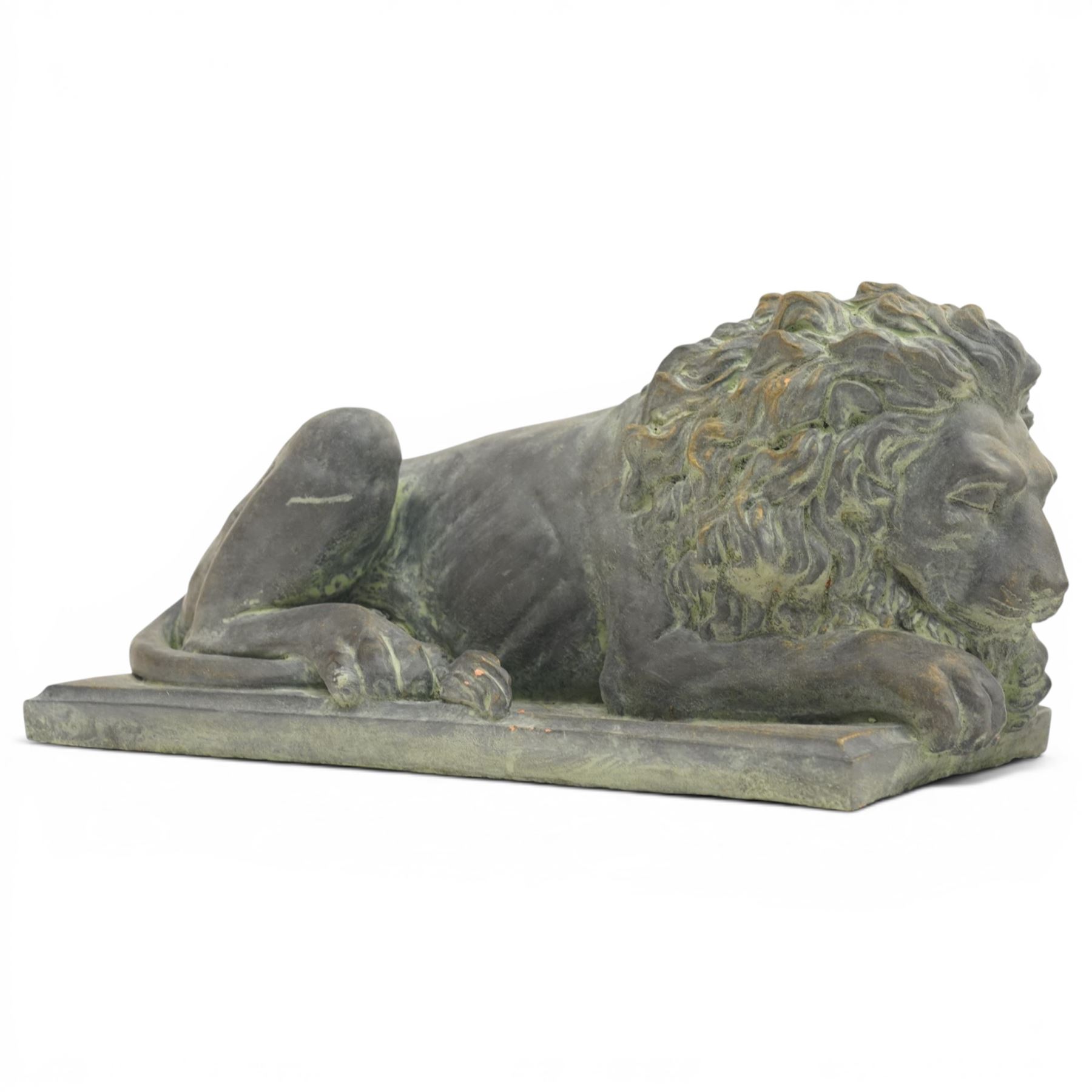 Pair of bronze effect lion figures, recumbent form with carved-style manes and outstretched forepaws, each on a rectangular base, with weathered green patinated finish