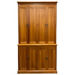 American cherry wood wall unit, top section fitted with two double cupboards enclosing shelves, lower section with four cupboard doors concealing six drawers