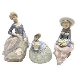 Three Lladro figures, comprising Evita no 5212, Petite Maiden no 5383 and Prim and Pretty no 5554, all with original boxes, largest example H18cm