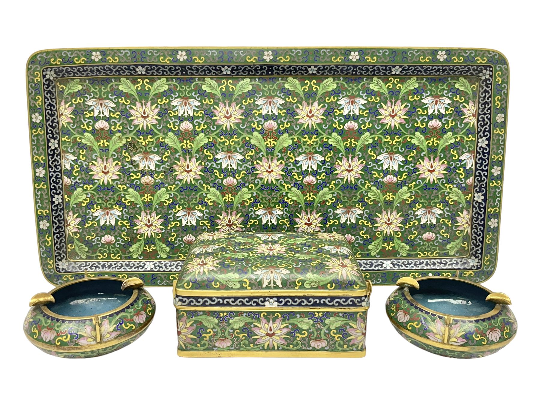 20th century Chinese cloisonne enamel smoking set, comprising two ashtrays, box and tray, with floral and foliate scrolling on green ground