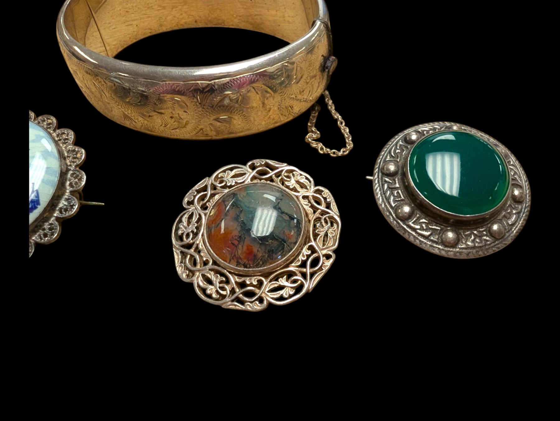 Silver bangle with four silver brooches