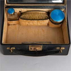 1920s silver mounted blue guilloche enamel travelling dressing table set, comprising hairbrush, comb, bottle and jar, hallmarked RWF Ltd, Birmingham 1927, contained withing tooled leather fitted case with bevelled mirror to interior