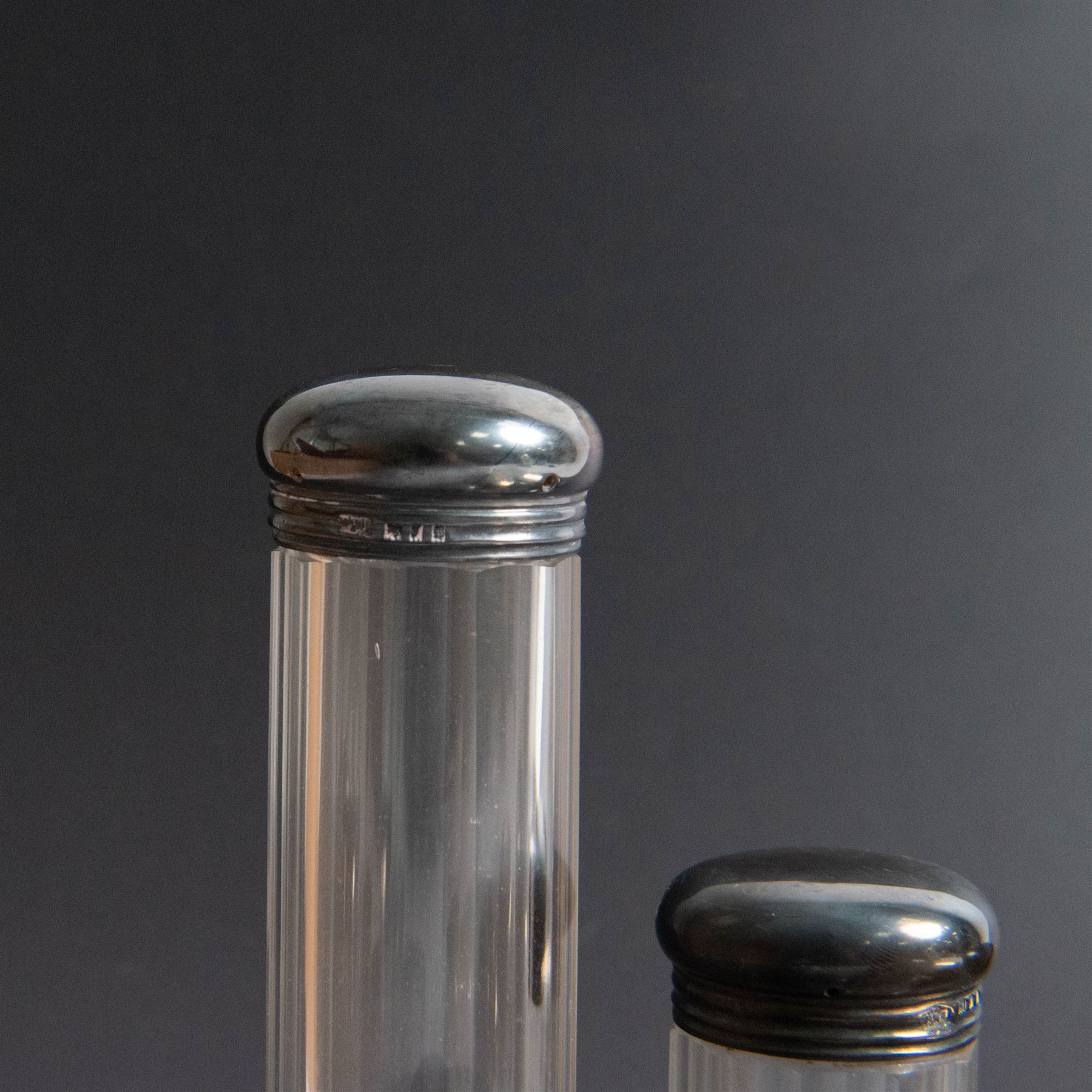 1920s gentleman's travelling case by Mappin & Webb Ltd, tan leather impressed with initials NAO, opening to reveal a compartmentalised interior containing silver mounted dressing table items, including a pair of silver mounted brushes, engraved NAO AMA 1918, hallmarked William Comyns, London 1911, five faceted glass jars and bottles with silver lids and a silver shaving brush holder, all hallmarked Mappin & Webb Ltd, London 1922, tan leather box containing razor, silver plated shoe horn, scissors and bevelled edge shaving mirror with easel support