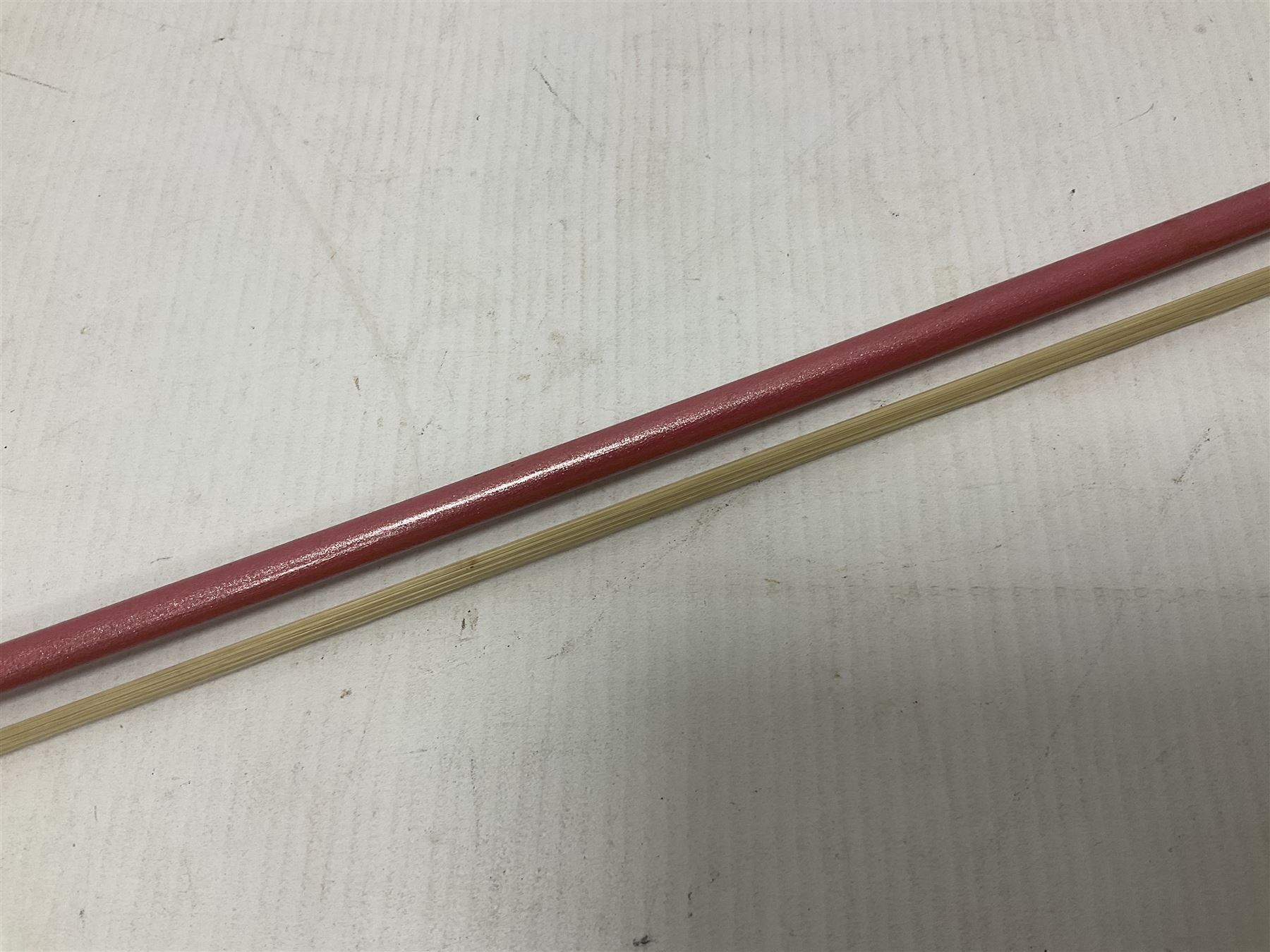 Zest full size pink violin, with a solid wood body and maple head, with matching pink bow and two further bows, in a hard case Length 60cm