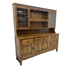 Traditional oak four drawer dresser, with plate display rack