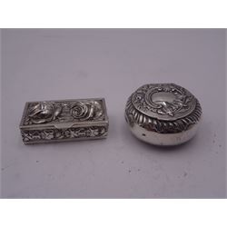 Continental silver pill box, of circular form with hinged cover, embossed with vacant panel with C scroll and foliate surround, hallmarked John George Smith, London 1897, F import mark, and further marks, probably Hanau, together with a modern silver example, of rectangular form, the hinged cover and sides embossed with roses and other flower heads, opening to reveal a gilt interior, hallmarked London import 1975, makers mark RR, and a modern silver miniature figure of a dog with 9ct gold collar, hallmarked D (S) Ltd, Birmingham 1976, approximate total weight 1.86 ozt (57.8 grams)
