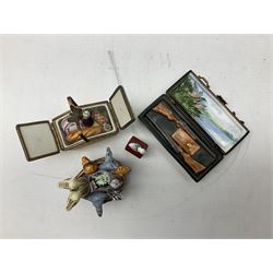 Group of Limoges trinket boxes, to include a number of novelty examples, including examples modelled as Noah's ark, shotgun case containing shotguns, picnic basket containing food, toad reading book seated upon a lily pad, etc., (9)