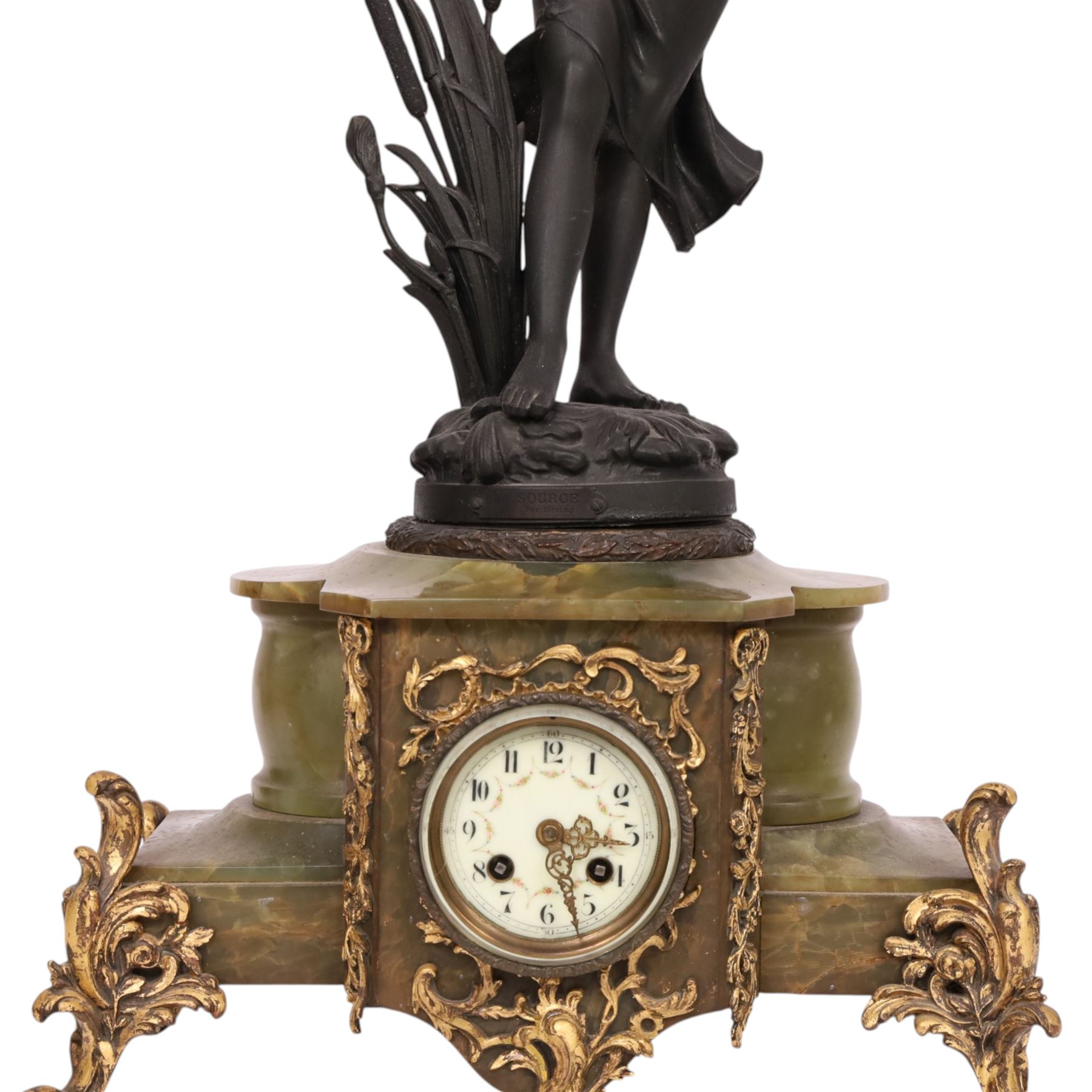 French green onyx clock, surmounted by a female figure amongst rushes, the enamel clock face with floral sprigs, H74cm 