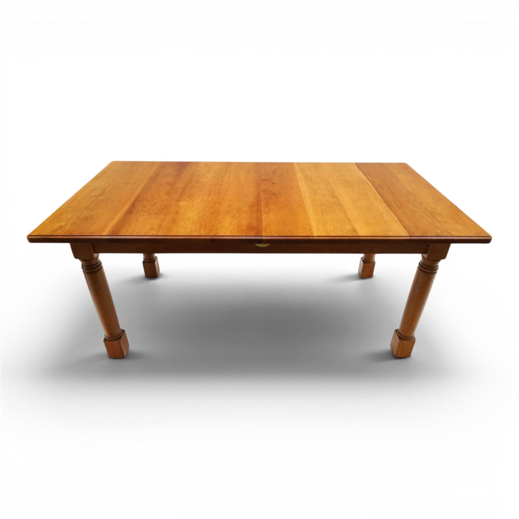 Knightman - cherrywood extending dining table, the rectangular top raised on four turned legs, with additional leaf extending to 230cm total, recessed carved knight trademark, by Horace Knight of Old Mill Furniture, Balk near Thirsk
