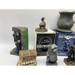 Terry Pratchett Discworld figures, comprising Roderick the hippo, DWE2, a 1995 event piece, Rincewind bookend, DW11, Death bookend, DW12, Librarians wizard knob, boxed, DW55, the luggage, boxed, DW04, tankard from the mended drum, DW21, Teppic the assassin, DW32, Greebo, DW45, Herne the hunted, DW64, Gaspode,  DW31, Quoth on skull, DW49 and Dibbler's compass DW16. 