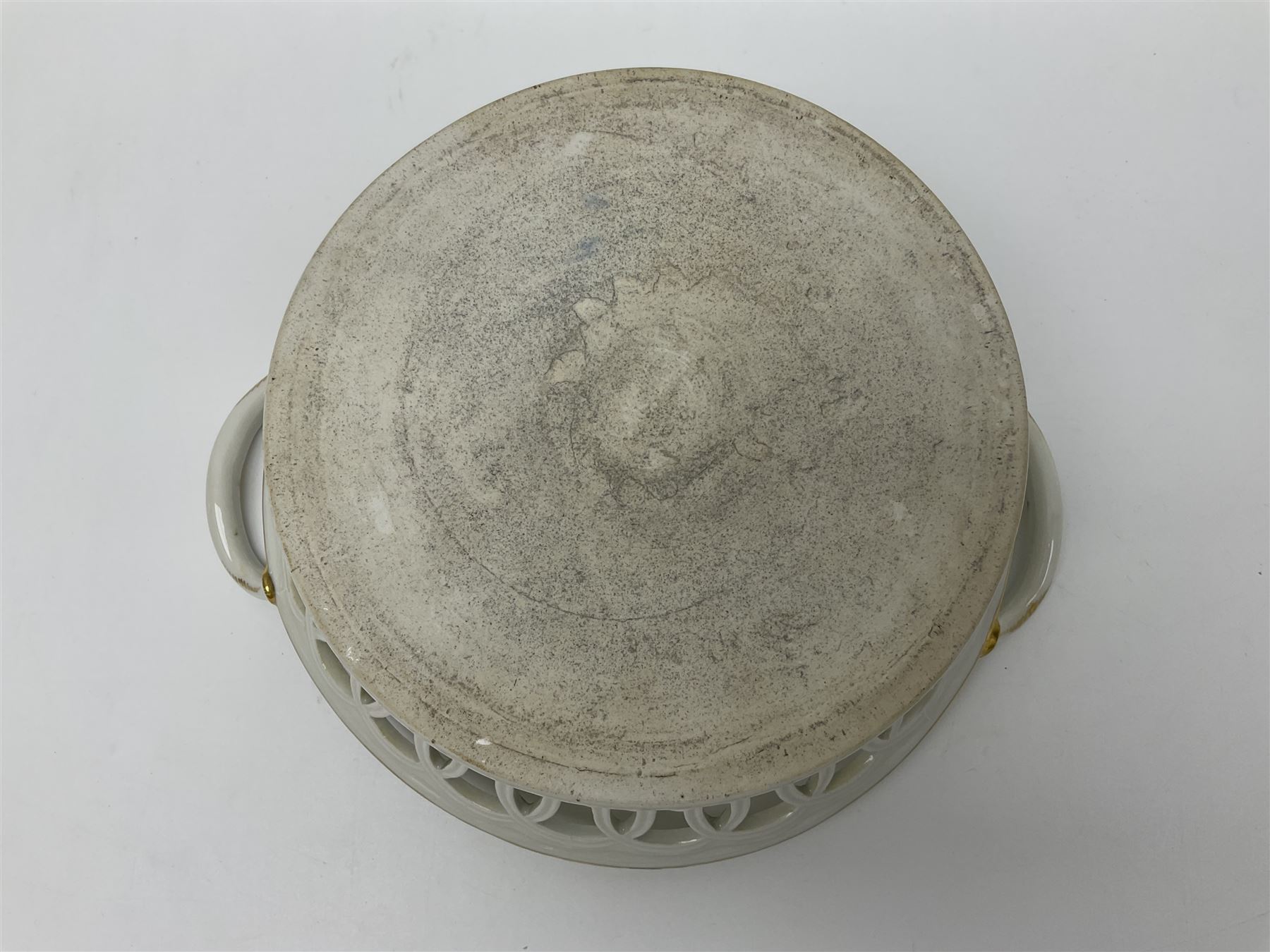 Pair of 19th century German openwork chestnut baskets, with twin handles and scrolling gilt border and star rim, painted to the centre with birds and insects, D22cm 