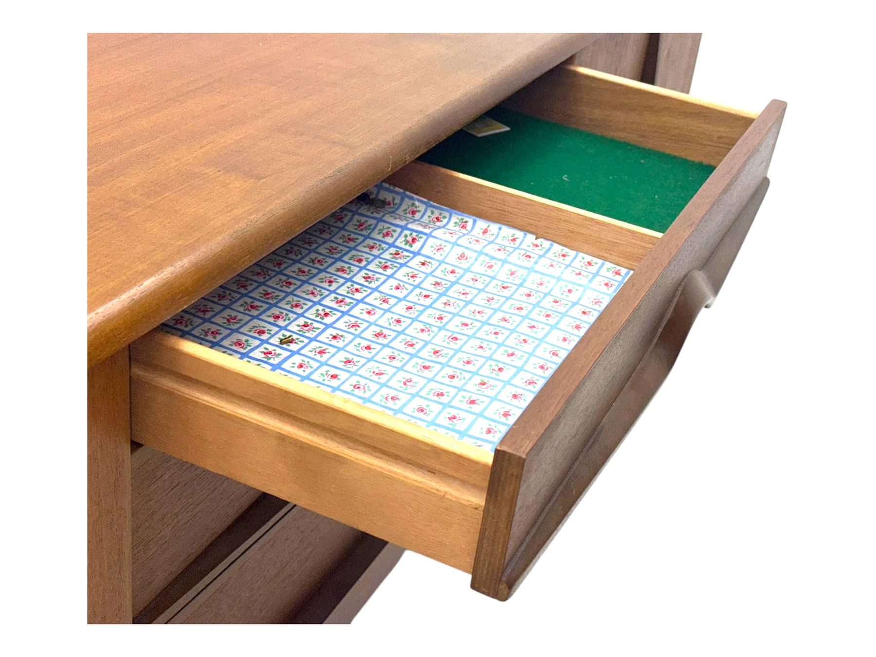 Stonehill - mid-20th century teak sideboard, three central drawers flanked by concertina cupboard doors, on tapering supports