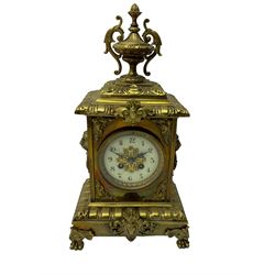French - 19th century 8-day brass cased mantle clock, with a stepped pediment surmounted by a decorative urn, rectangular case with lion’s head side pieces on a stepped plinth raised on paw feet, enamel dial with a pierced brass centre, roman numerals, minute markers and steel fleur di Lis hands, with an eight-day French countwheel striking movement striking the hours and half-hours on a bell. With pendulum.