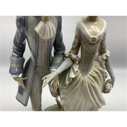 Lladro figure, Walk in Versailles, modelled as a man and woman in period dress, sculpted by Vincente Martinez, no 5004, year issued 1978, year retired 1981, H40cm 