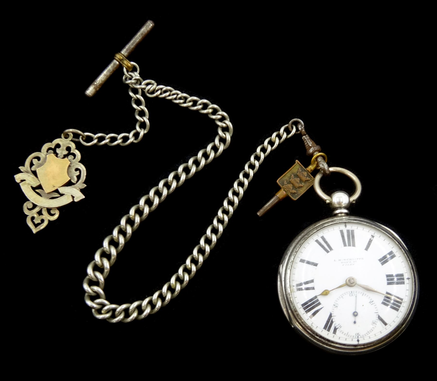 Victorian silver open face key wound lever pocket watch by L. Hinchcliffe, Hope Street, Filey, No. 67874, white enamel dial with Roman numerals and subsidiary seconds dial, case by Samuel Yeomans, Chester 1893, on white metal Albert chain with silver fob
