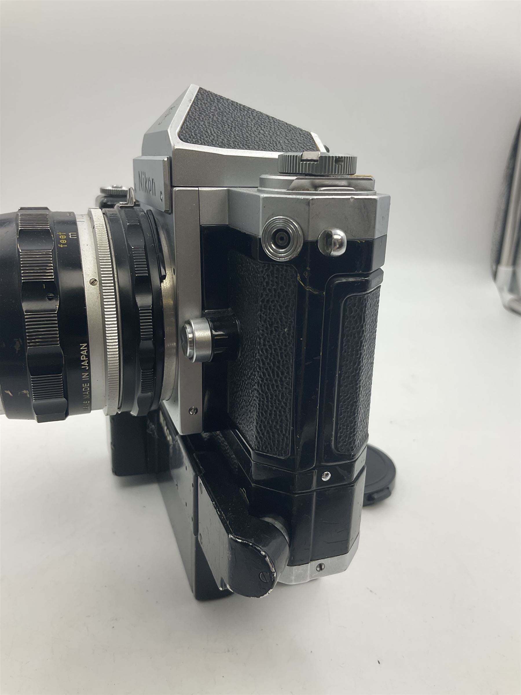 Nikon F NKJ plain prism camera body, serial no. 6520477, with 'Nikon NIKKOR-S Auto 1:2.8 f=35mm' lens, serial no. 344731, Nikon F36 Motor Drive NKJ, serial no. 122780 and Nikon cordless battery pack