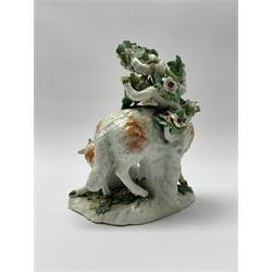 18th century Derby porcelain group, modelled as a ram standing before bocage above a recumbent lamb, upon flower encrusted base, H13.5cm, together with an 18th century Derby figure modelled as a deer, in recumbent pose before bocage, H8cm, each with patch marks beneath, 