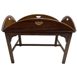 Mahogany butler's tray top coffee table, the removable tray with hinged sides and ends pierced with handles, on square moulded supports united by H stretcher 
