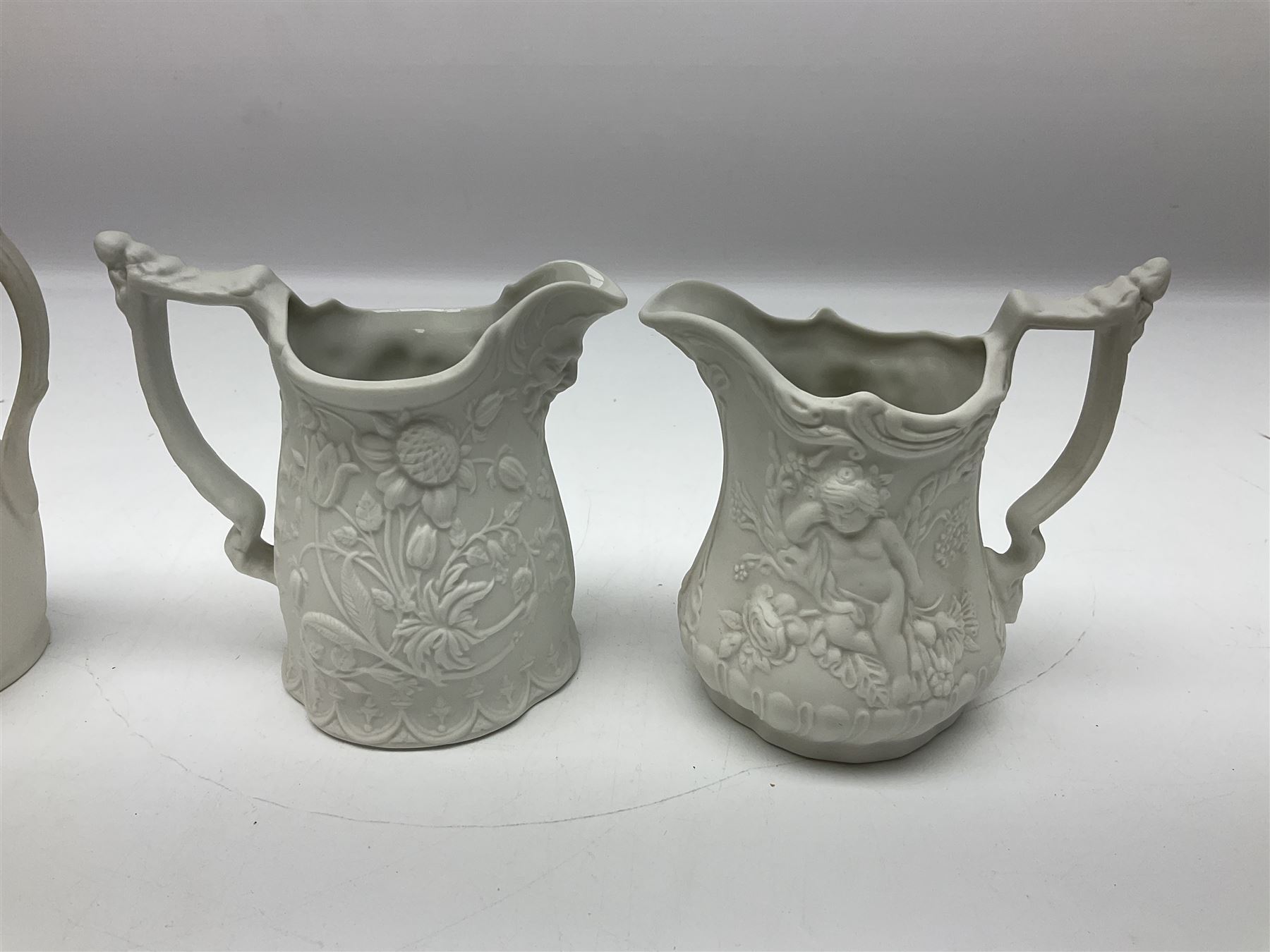  Six Portmeirion British Heritage Collection parian jugs, of various designs, H12cm