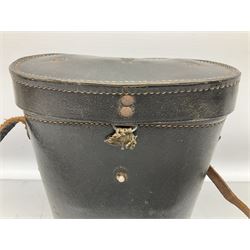Pair of WWII German U-boat binoculars probably 7 x 50 by Leitz, with rubber eye piece protector covers and leather case stamped with Kriegsmarine mark to the lid and dated 1944, with leather strap.