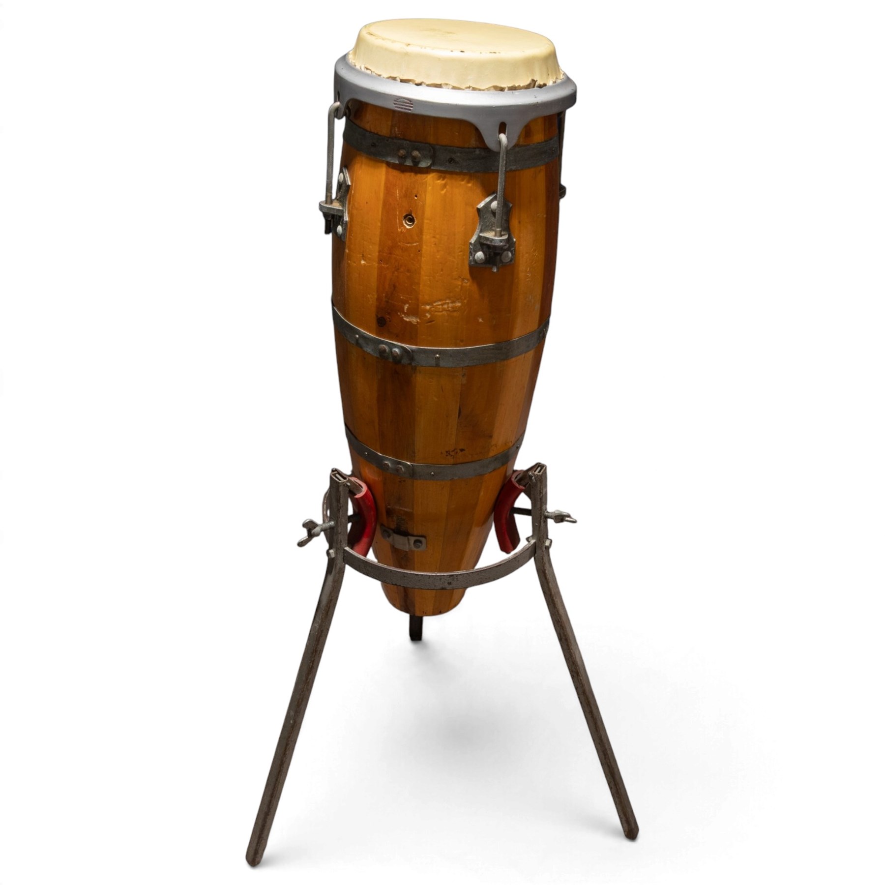 Three conga drums, comprising two Excelsior A. Salvadori Firenze stave-built wooden congas and one similar French example, with skin heads and metal tension mounts, on metal stands with hard carry cases for drums, tallest H79cm, D31cm