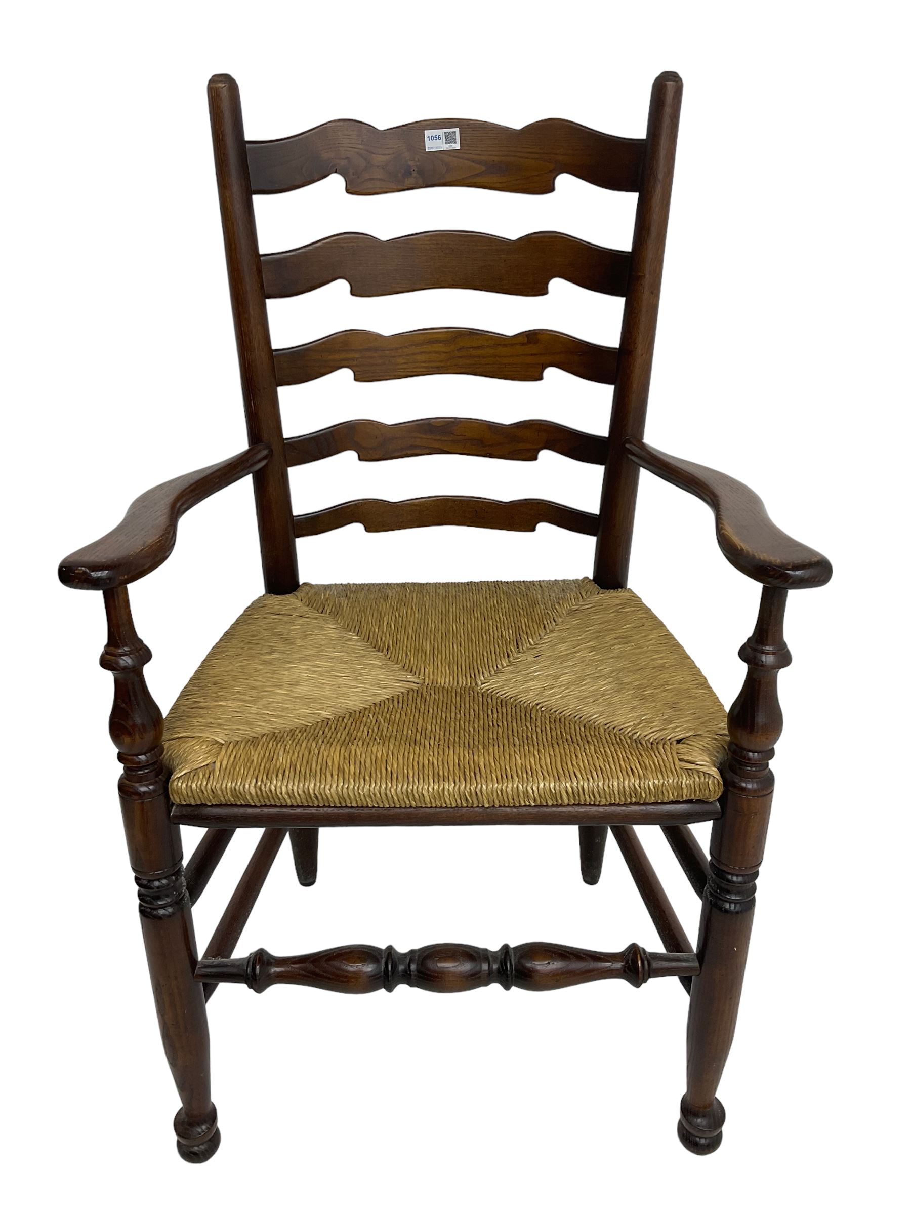 Set eight (6+2) oak dining chairs, high waived ladder back over rush seats, raised on ring turned supports with pad front feet, united by stretchers