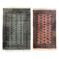 Pair of Pakistani Bokhara wool rugs one with green ground (L 187cm, W 124cm) and one with ...