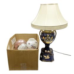 Large table lamp in the form of an urn upon a plinth, decorated with flowers, together with a pair of table lamps, glass shades etc