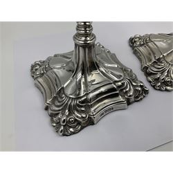 Pair of late Victorian silver mounted candlesticks, each of knopped and part fluted form, upon square stepped base with anthemions to each corner, with conforming sconces, hallmarked to removable sconces and foot, Thomas A Scott, Sheffield 1901, H25.2cm