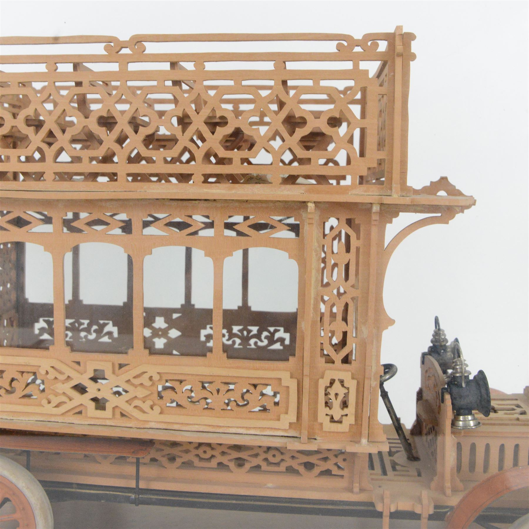 Early 20th century fretwork model of an omnibus, contained within glazed wooden case, case H45cm