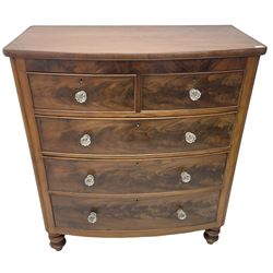 Victorian mahogany bow front chest, fitted with two short over three long graduating cock-beaded drawers, each with glass handles, raised on turned feet