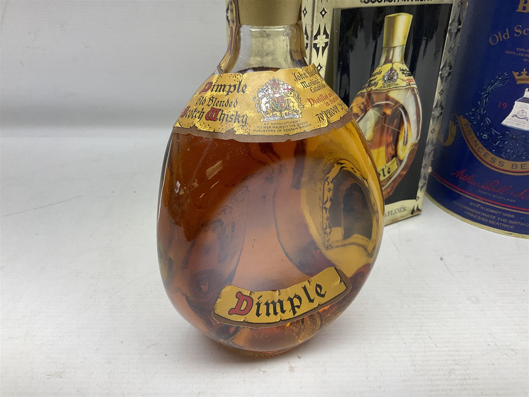 John Haig & Co Dimple Scotch whisky, 26 2/3 fl oz, 70% proof, one bottle and Bells Princess Beatrice whisky in original box, 75cl, 43% vol, one bottle (2)