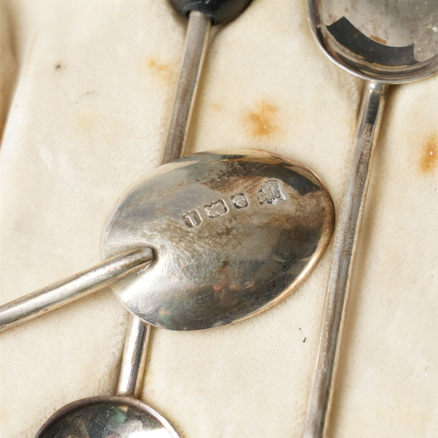 Cased set of twelve silver coffee spoons with bead knop terminals Birmingham 1910 Maker S W Smith & Co and two cases, each containing six silver handled pastry knives
