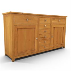 Solid oak sideboard fitted with drawers and cupboards, central bank of six drawers, metal pulls 