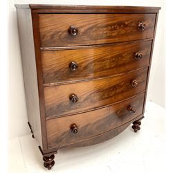 Victorian mahogany bow front chest, four graduating drawers, turned supports
