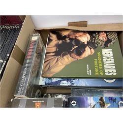 Three boxes of books, periodicals and DVDs of military interest with particular emphasis on WW2 including The History of World War Two in thirty original parts by Orbis, The D-Day Experience by Richard Holmes, The World War Two Databook, The World at War, Special Forces etc