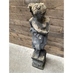 Cast stone weathered garden statue of Venus on pedestal