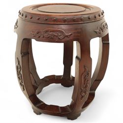 Pair of early 20th century Oriental hardwood barrel seats, of drum form with shaped apron and pierced panels, carved with stylised scrollwork and studded detail to the top