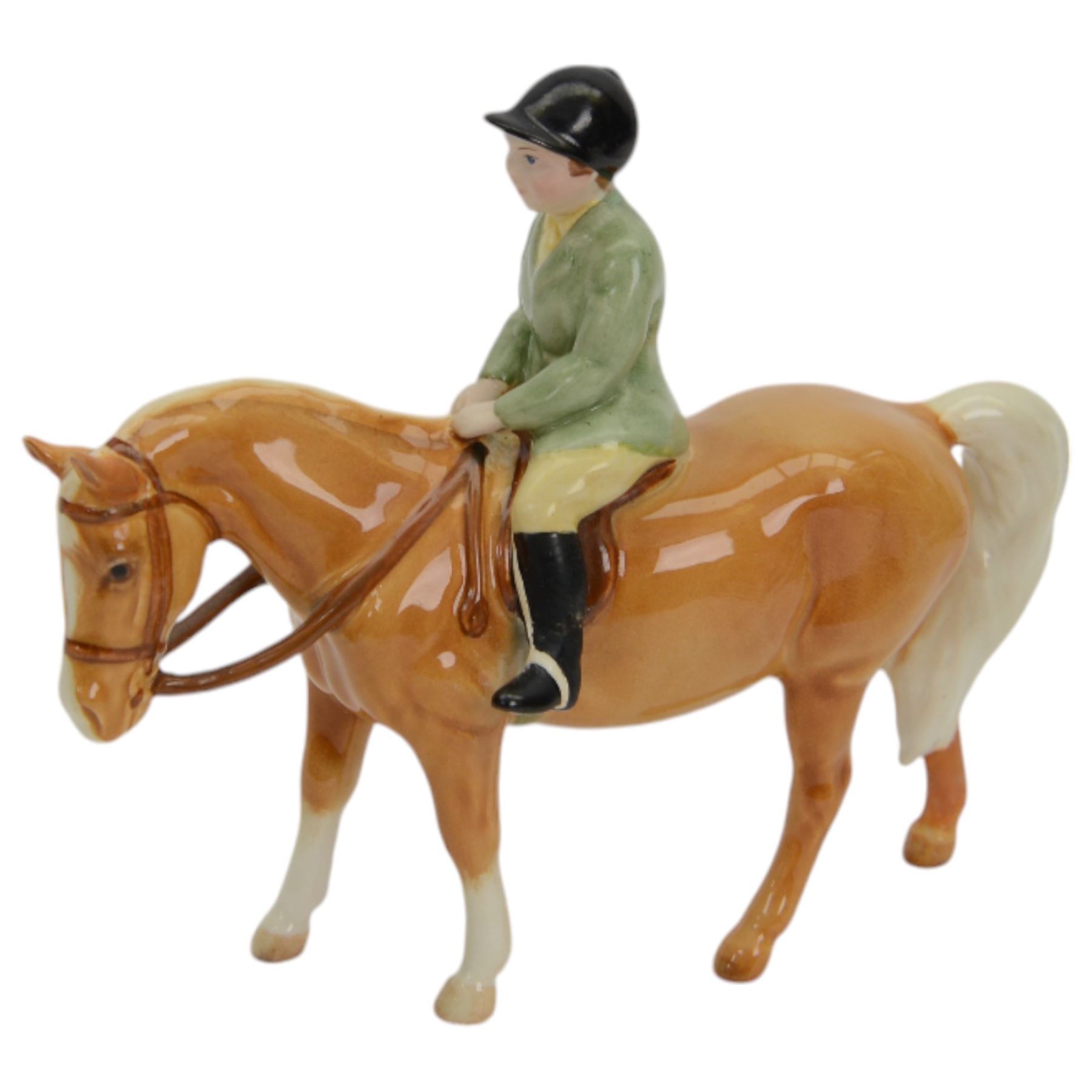 Two Beswick figures, comprising Boy on palomino pony no 1500 and Thelwell Angel on Horseback