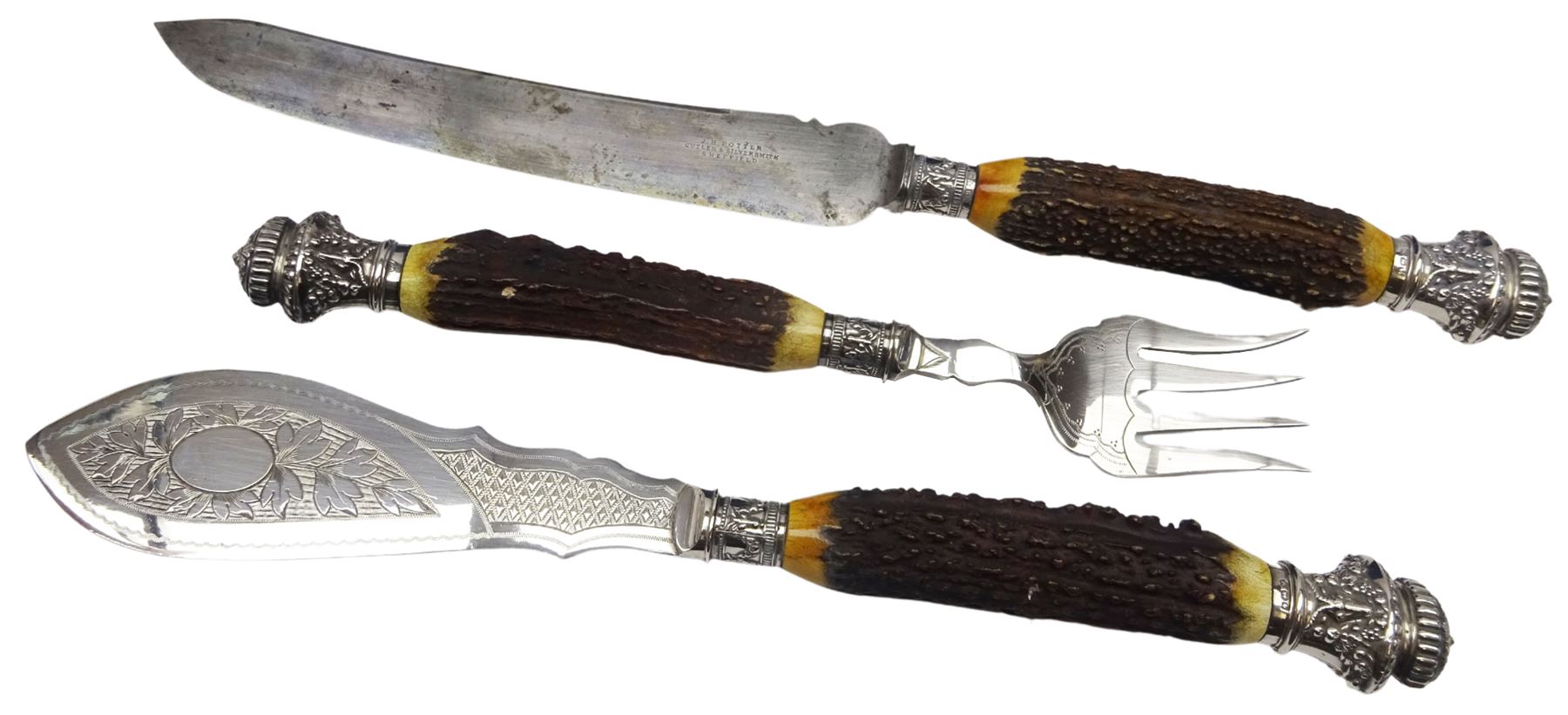 Victorian seven piece silver mounted antler handled carving set, the silver ferrules and terminals embossed with deer masks and fruit swags, hallmarked Francis Cholerton, and Mappin Brothers, Sheffield 1888, two steel blades stamoed J H Potter Cutler & Silversmith Sheffield, and one prong stamped J H Potter, contained within a fitted mahogany case with vacant brass cartouche to the hinged cover 

