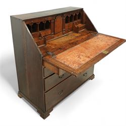 George III oak bureau, the fall front enclosing a fitted interior of small drawers and pigeonholes, above seven graduated drawers with brass plate handles and bone escutcheons, raised on bracket feet