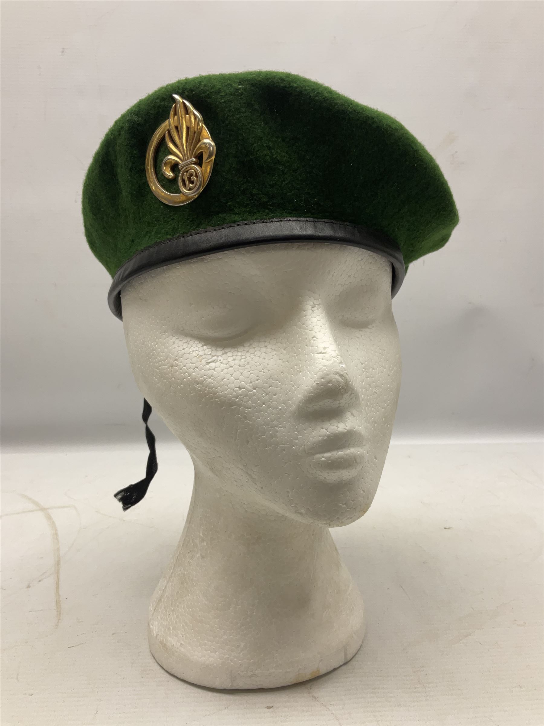 Four paratrooper berets - Russian, Italian, British and Foreign Legion; all with badges (4)