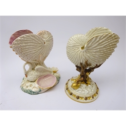  Two Royal Worcester nautilus shell vases, swan support on naturalistic shell shaped base, the other with gilt shell moulded support, H22cm   