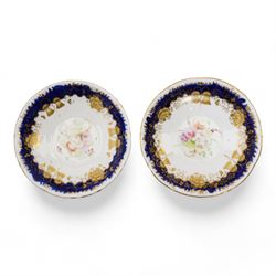 19th century porcelain part tea service, probably Spode, comprising sucrier, milk jug, sandwich plate, seven cups and two saucers, decorated with floral sprays, within cobalt blue and gilt borders, pattern no. 735 
