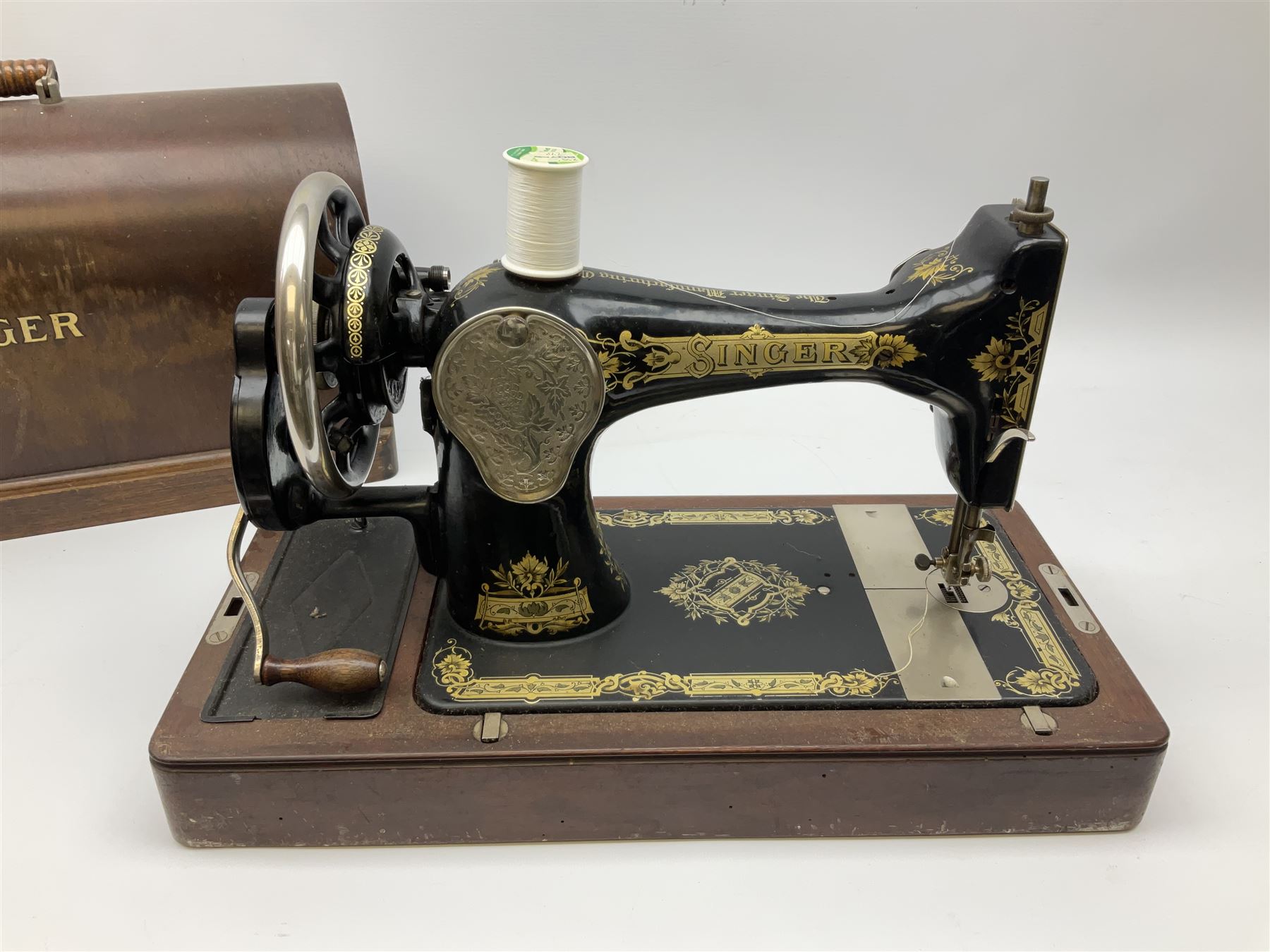 Cased early 20th century Singer hand sewing machine, lacking key