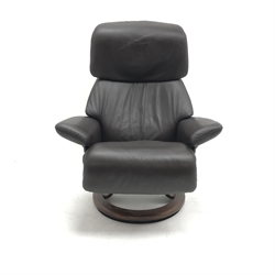 Stressless armchair upholstered in a chocolate leather, shaped support, (W81cm) and a Stressless Ellipse table