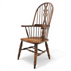 Late 20th century elm and beech high back Windsor armchair, the arched hoop back with pierced vase shaped splat between turned spindles, shaped arm rail on turned supports, saddle seat, raised on turned legs united by a crinoline stretcher