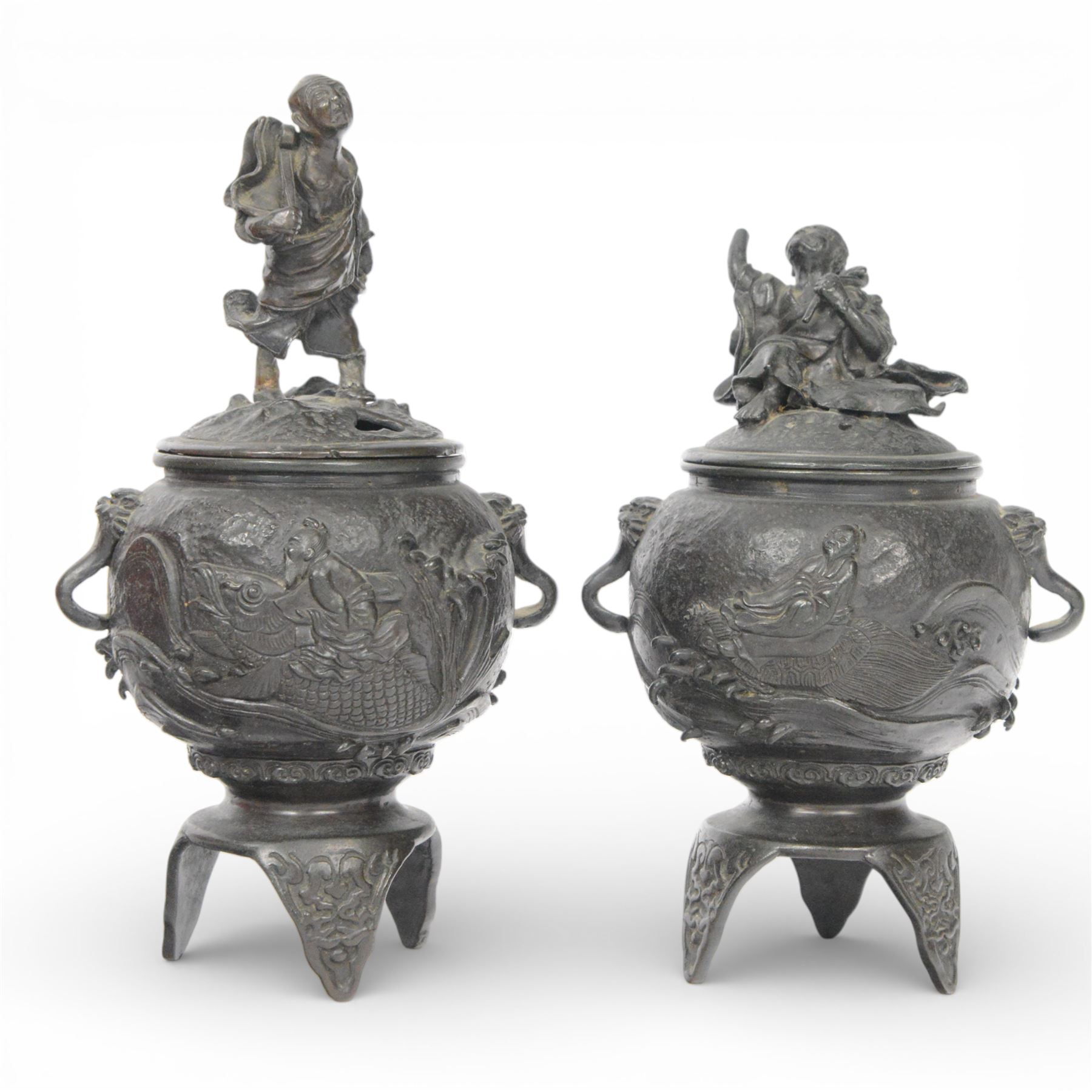 Pair of Japanese bronze koro, raised upon three feet, he body of the koro decorated with figures and animals, the cover mounted with figures, H24cm